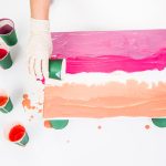 preparing canvas for acrylic pour